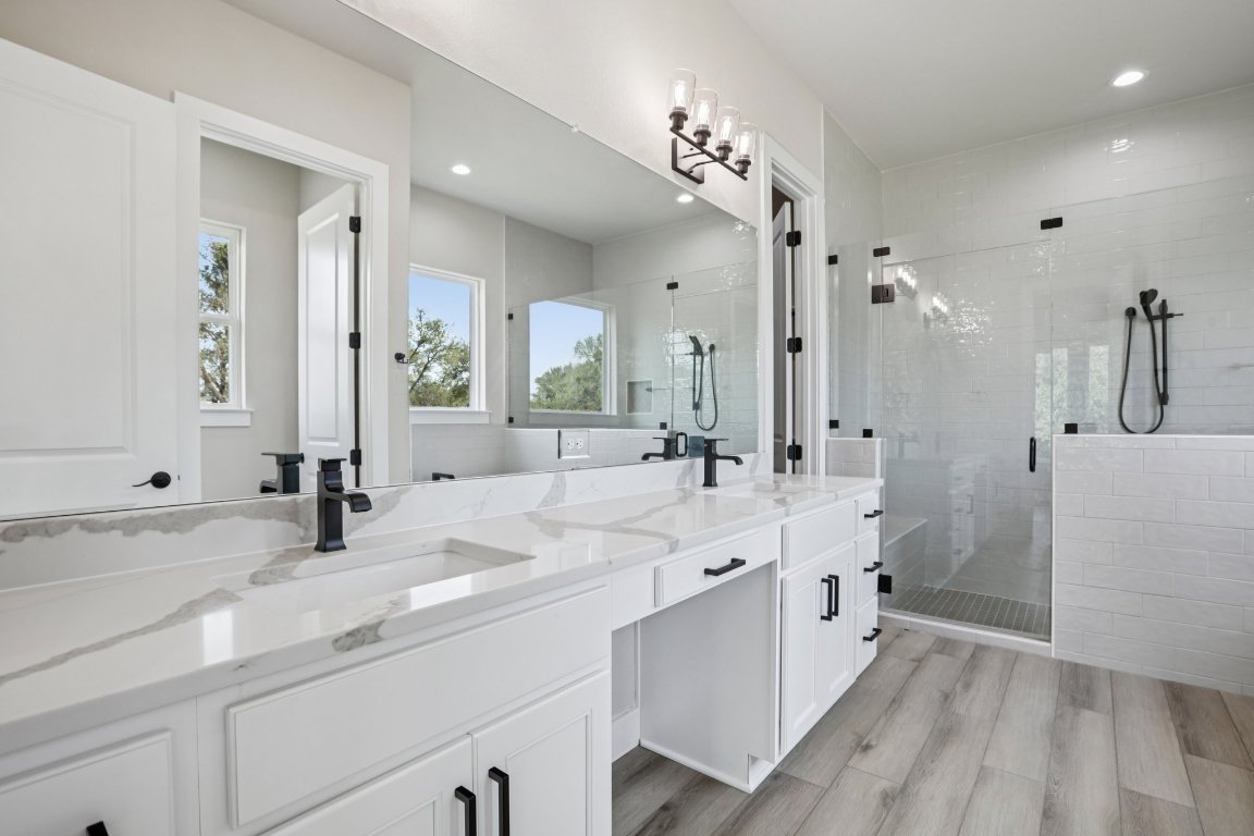 320 Yellow Ribbon Trail Burnet, TX 78611 - Photo 18 of 30 a bathroom with double vanity sink and a mirror
