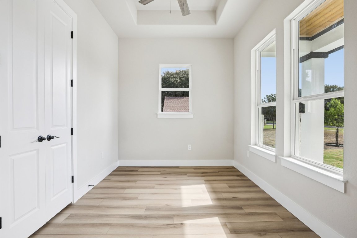 320 Yellow Ribbon Trail Burnet, TX 78611 - Photo 5 of 30 a view of an entryway with wooden floor and windows