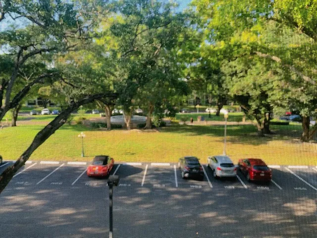 a view of a lake with couches and chairs