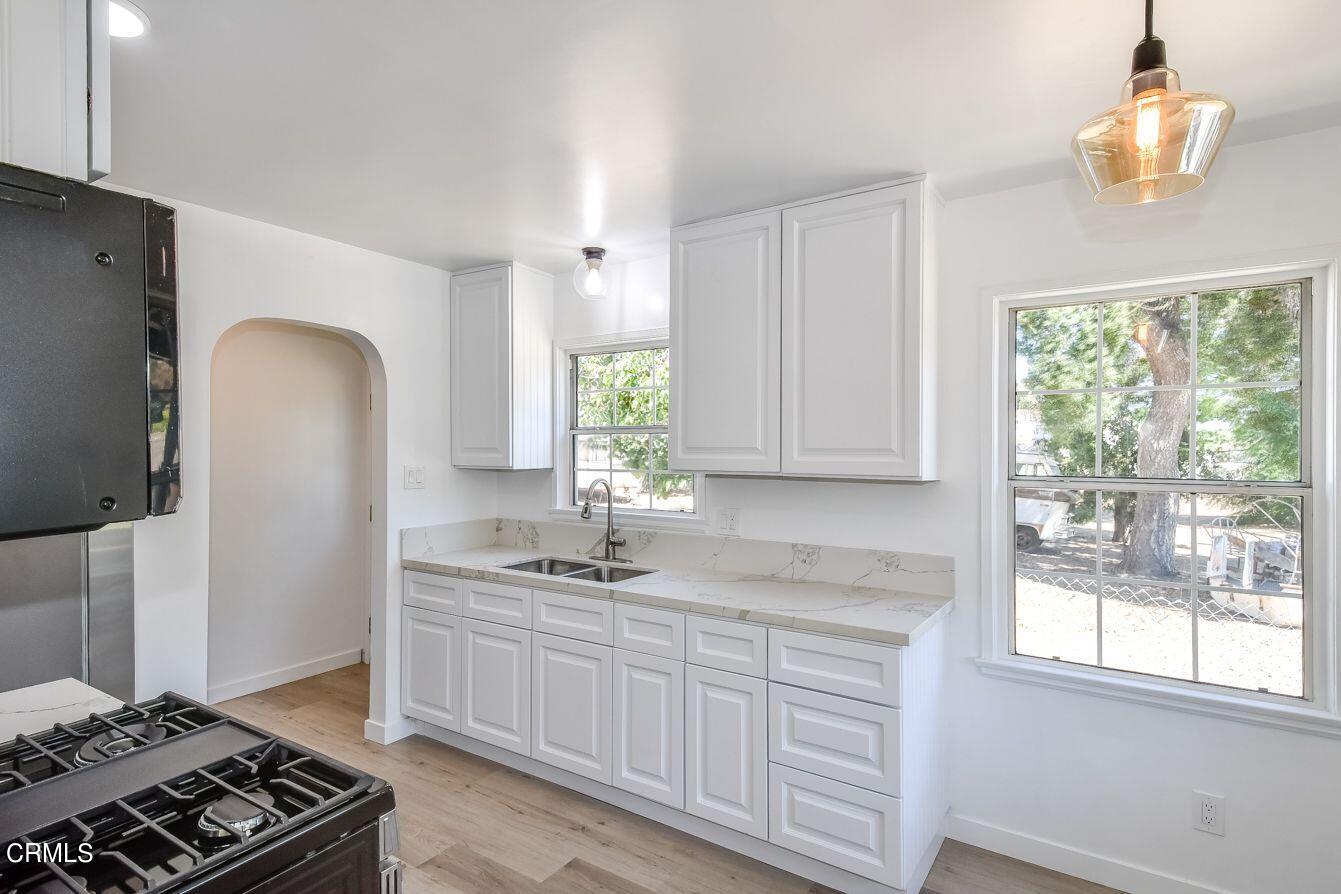 9730 1/2 Tujunga Canyon Boulevard Tujunga, CA 91042 - Photo 11 of 23 a kitchen with a sink stove and window