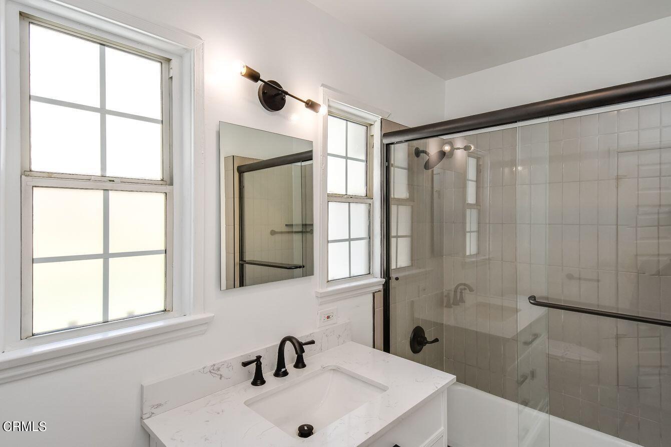 9730 1/2 Tujunga Canyon Boulevard Tujunga, CA 91042 - Photo 16 of 23 a bathroom with a sink and a mirror