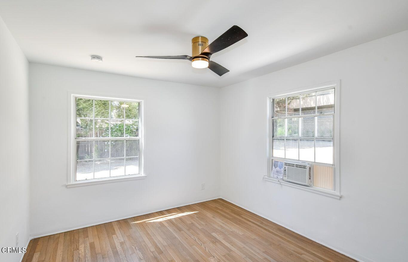 9730 1/2 Tujunga Canyon Boulevard Tujunga, CA 91042 - Photo 17 of 23 a view of empty room with wooden floor and fan