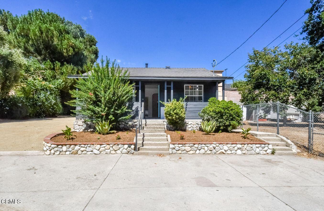 9730 1/2 Tujunga Canyon Boulevard Tujunga, CA 91042 - Photo 2 of 23 a front view of a house with a garden