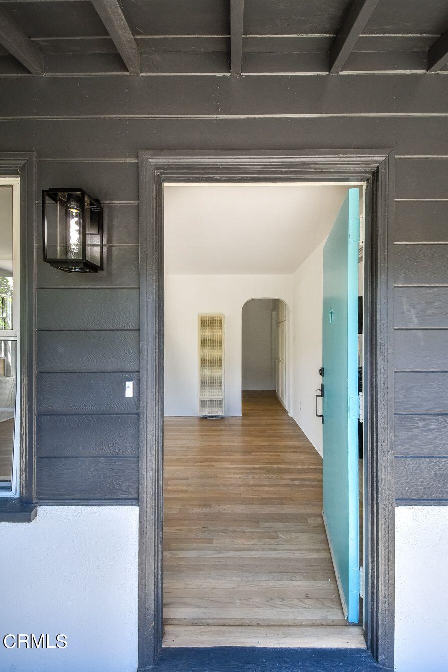 9730 1/2 Tujunga Canyon Boulevard Tujunga, CA 91042 - Photo 5 of 23 a view of a hallway with wooden floor and staircase