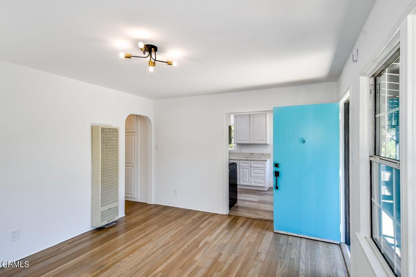 9730 1/2 Tujunga Canyon Boulevard Tujunga, CA 91042 - Photo 6 of 23 wooden floor in an empty room with a window