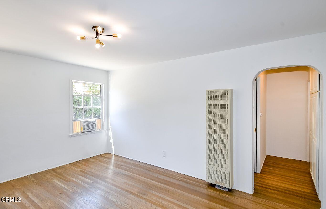 9730 1/2 Tujunga Canyon Boulevard Tujunga, CA 91042 - Photo 7 of 23 an empty room with closet and wooden floor