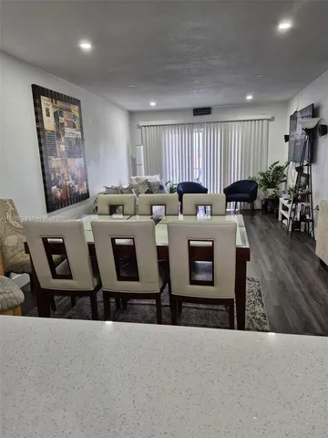 a living room with a couch and a large window