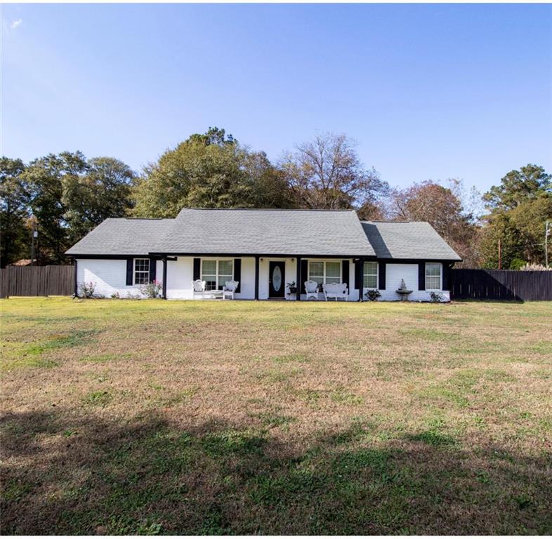 275 Wilson Road Covington, GA 30016 - Photo 1 of 1 a front view of a house with a garden