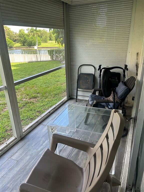 3521 Inverrary Drive, Unit J109 Lauderhill, FL 33319 - Photo 12 of 15 a view of a balcony with chair and table