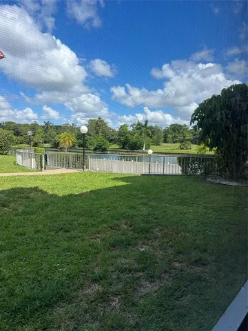a view of a lake with a big yard