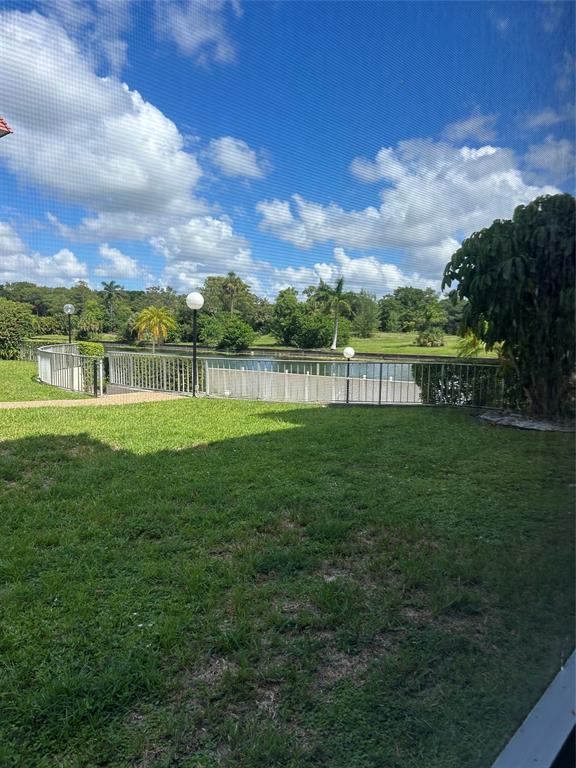 3521 Inverrary Drive, Unit J109 Lauderhill, FL 33319 - Photo 13 of 15 a view of a lake with a big yard