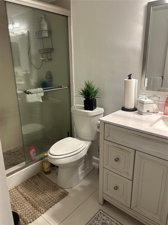 3521 Inverrary Drive, Unit J109 Lauderhill, FL 33319 - Photo 7 of 15 a bathroom with a sink a toilet and shower