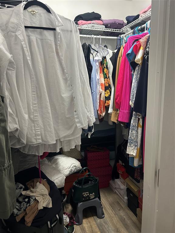 3521 Inverrary Drive, Unit J109 Lauderhill, FL 33319 - Photo 8 of 15 a view of walk in closet with clothes and shoes