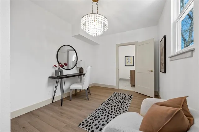 a view of a livingroom with furniture and window