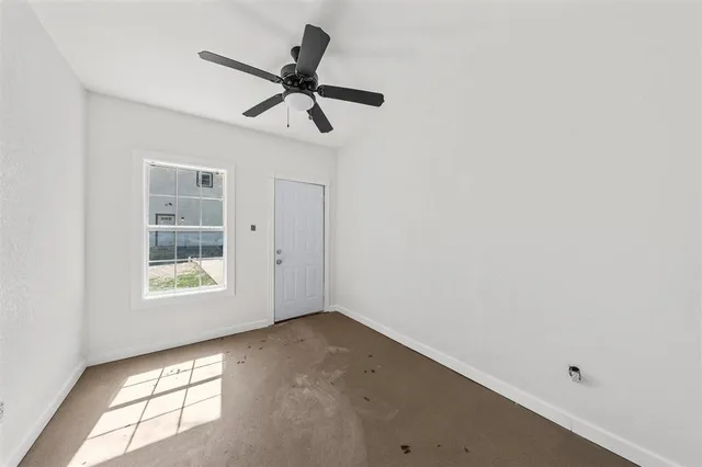 a view of a big room with carpet