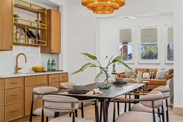 a view of a dining room with furniture and window