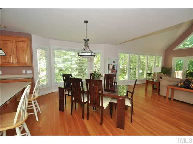 6424 Rushingbrook Drive Raleigh, NC 27612 - Photo 24 of 25 a view of a dining room with furniture window and wooden floor