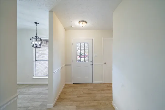 a view of an entryway with wooden floor