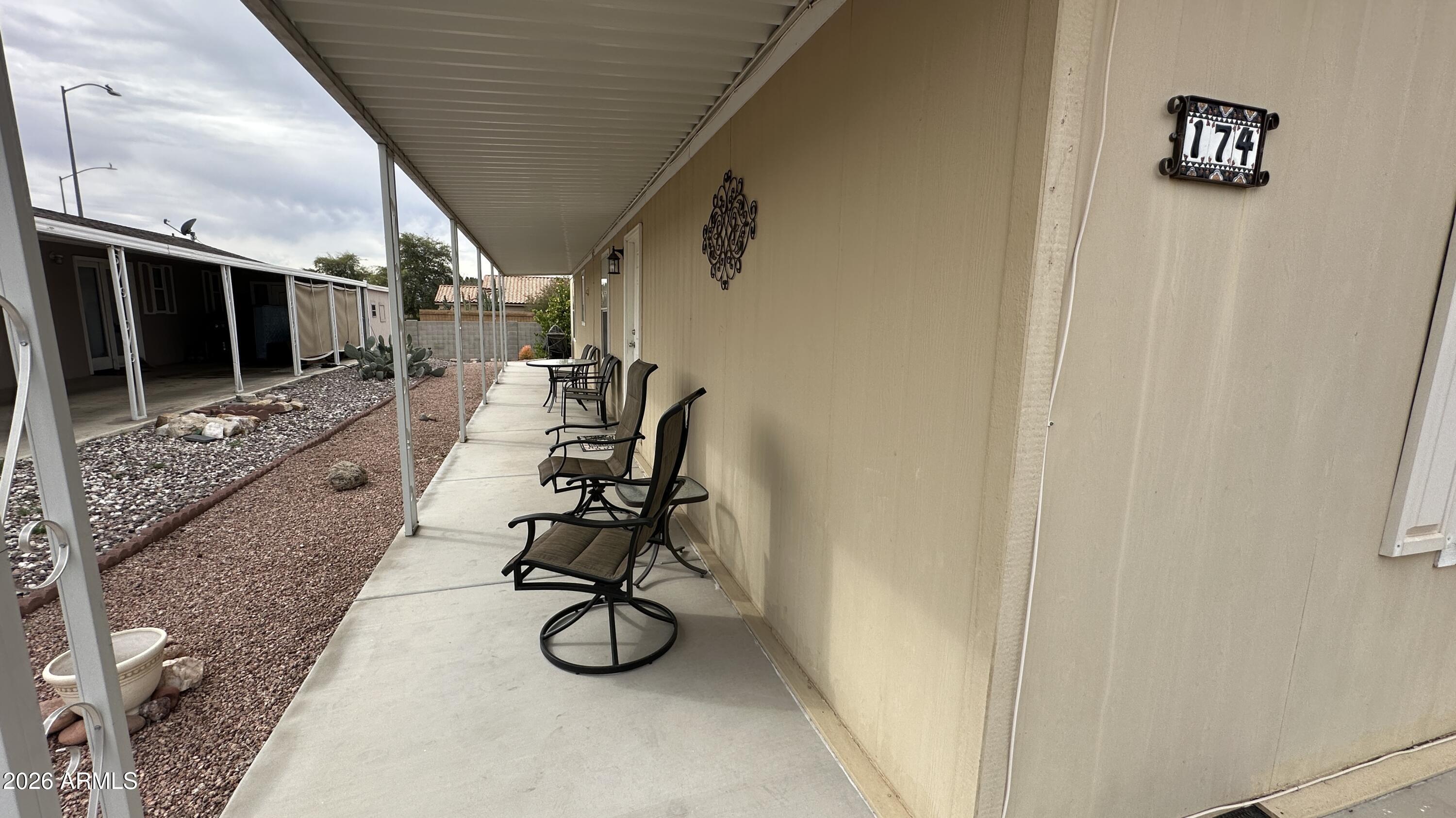 834 South Meridian Road, Unit 174 Apache Junction, AZ 85120 - Photo 12 of 56 a view of entryway with wooden floor and furniture