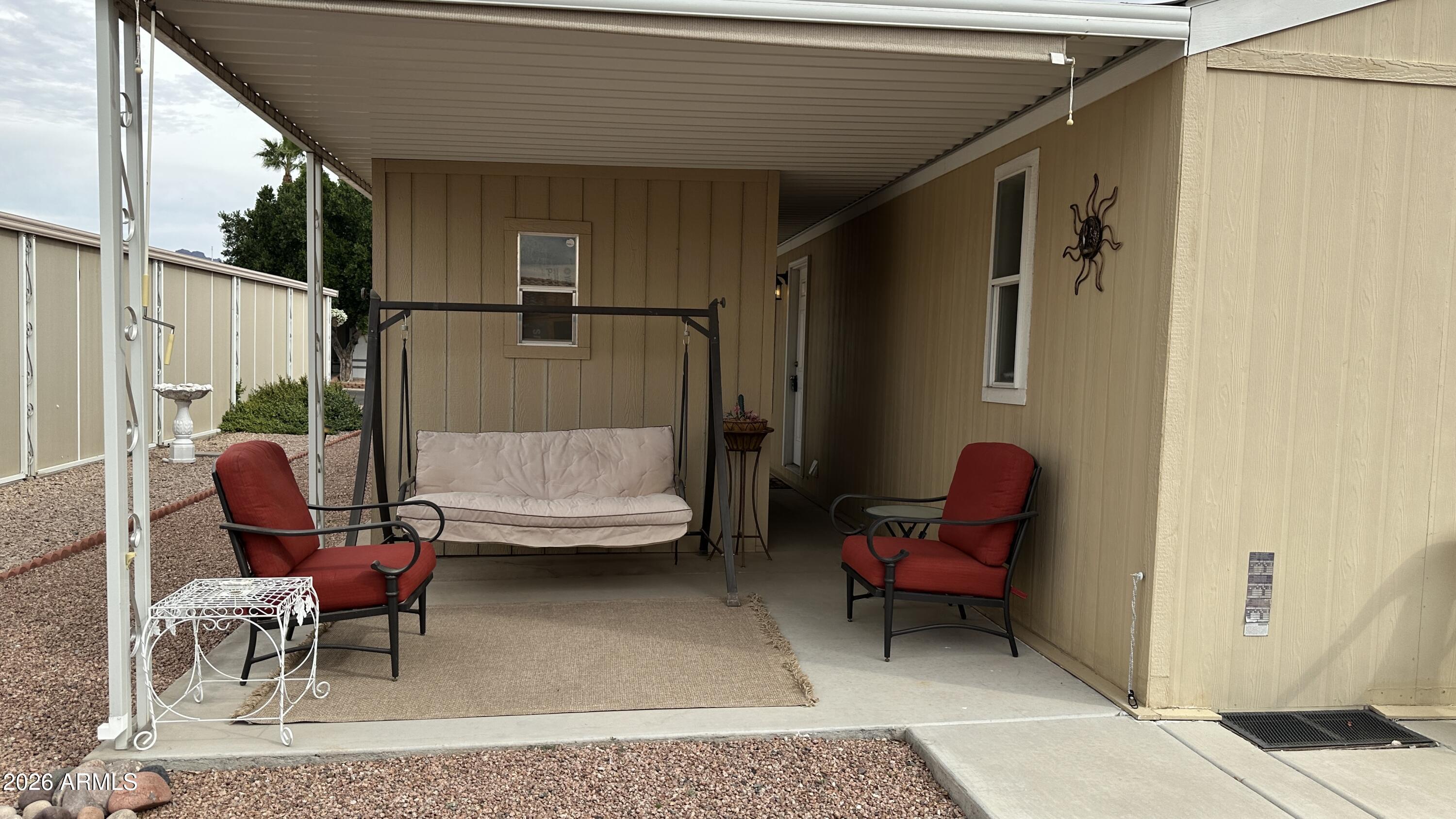 834 South Meridian Road, Unit 174 Apache Junction, AZ 85120 - Photo 15 of 56 a outdoor space with a couch and chairs