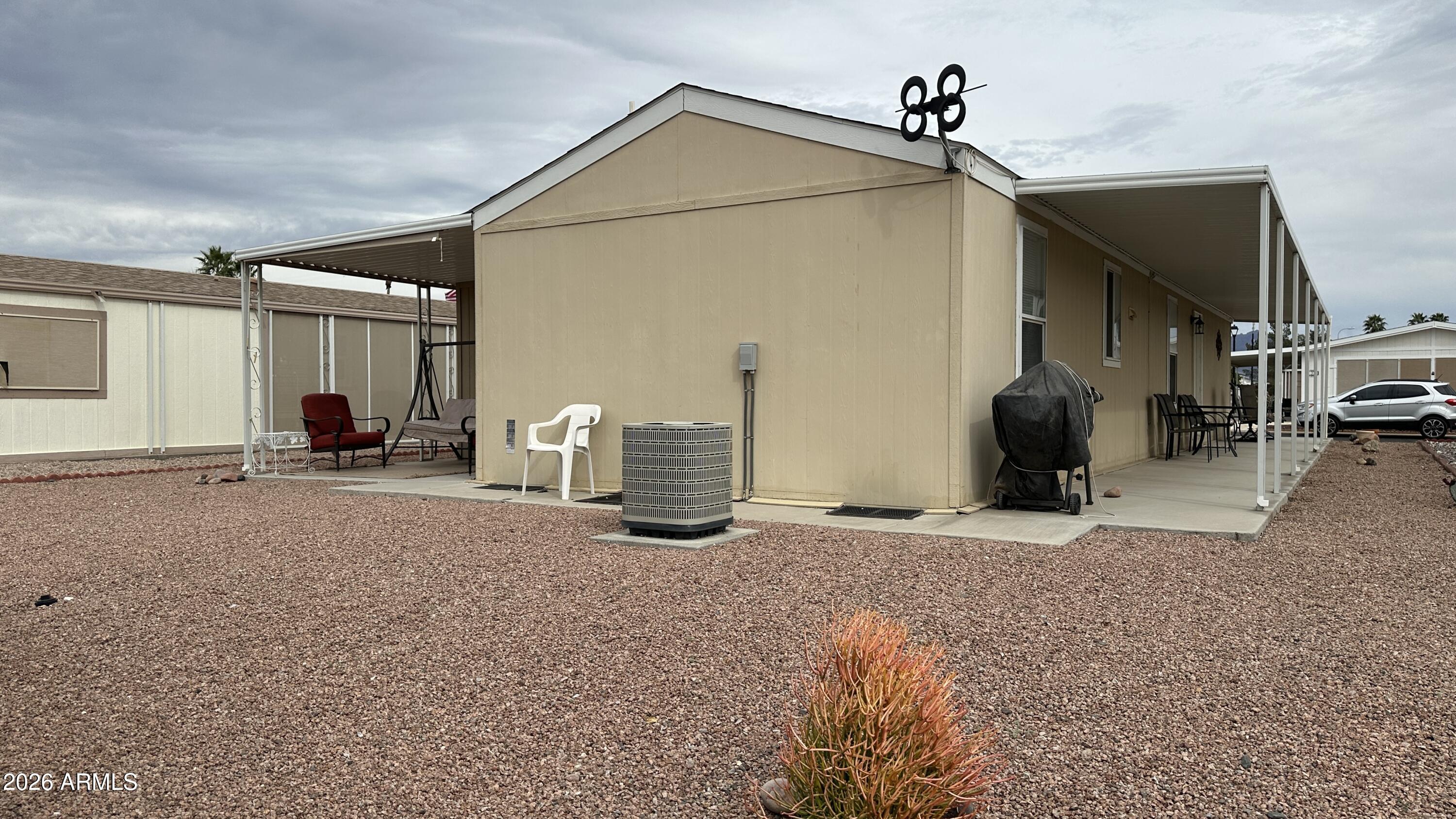 834 South Meridian Road, Unit 174 Apache Junction, AZ 85120 - Photo 17 of 56 a view of a house with patio