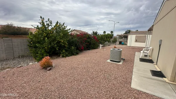 a view of a backyard with plants and flowers