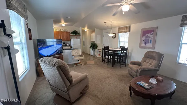 a living room with furniture and a large window