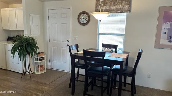 a living room with furniture a table and a chandelier
