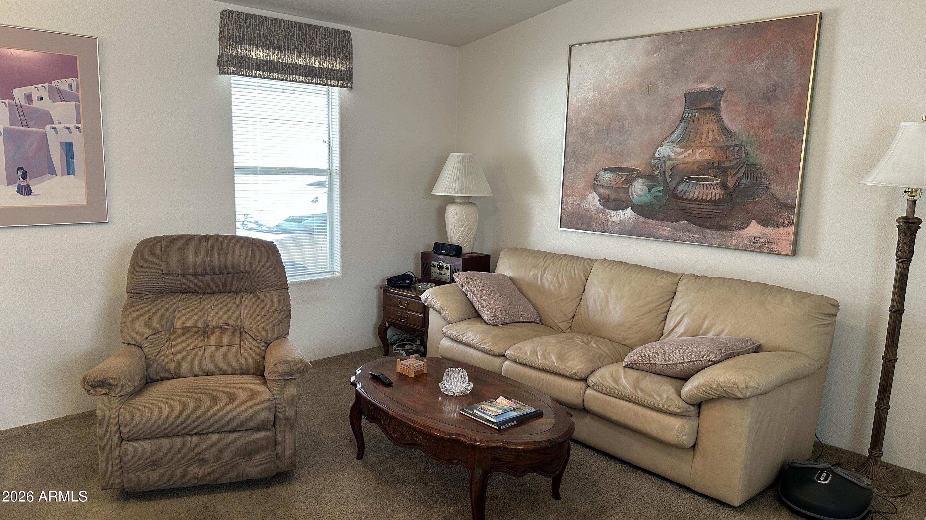 834 South Meridian Road, Unit 174 Apache Junction, AZ 85120 - Photo 27 of 56 a living room with furniture and a window
