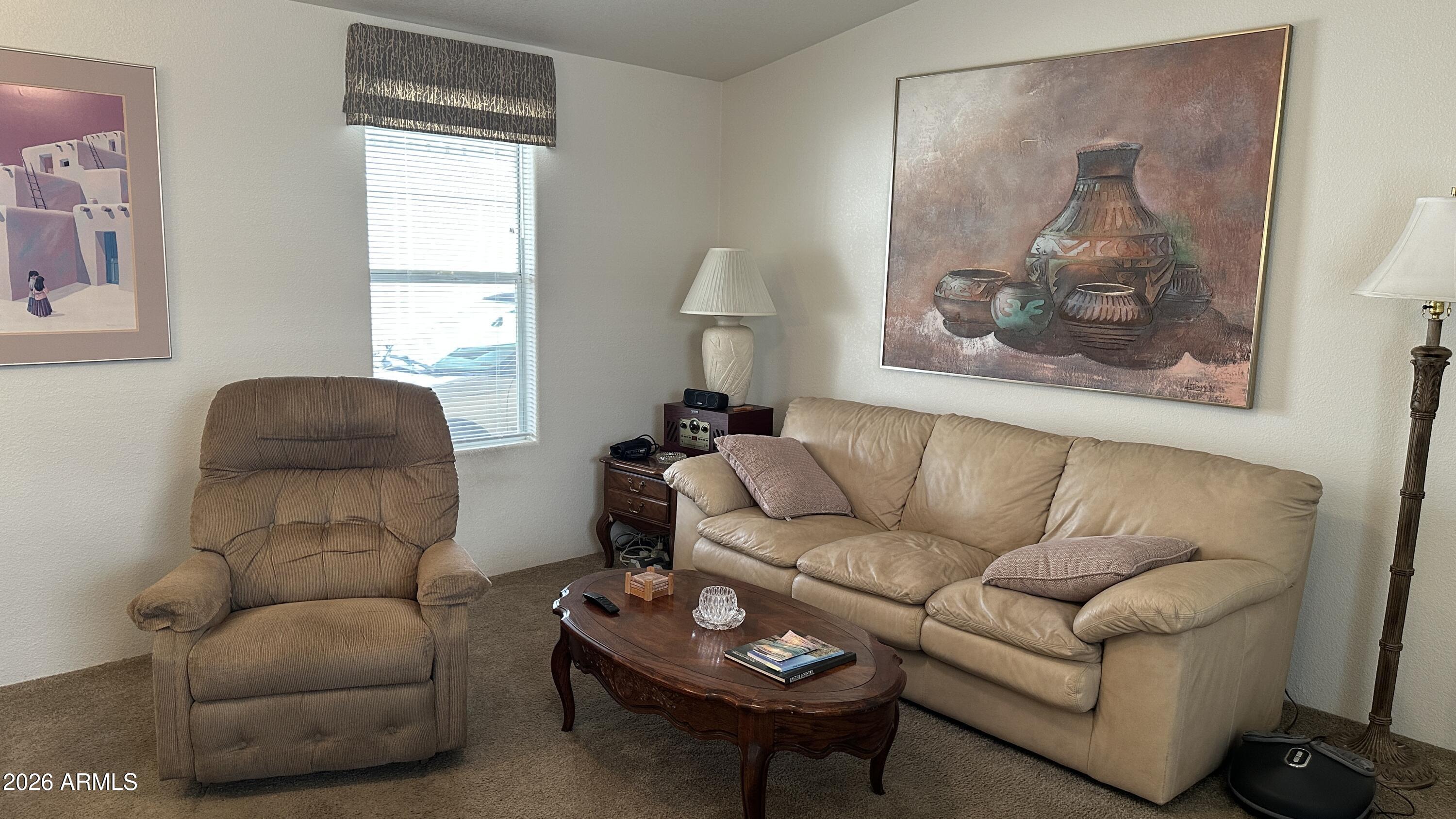 834 South Meridian Road, Unit 174 Apache Junction, AZ 85120 - Photo 28 of 56 a living room with furniture and a window