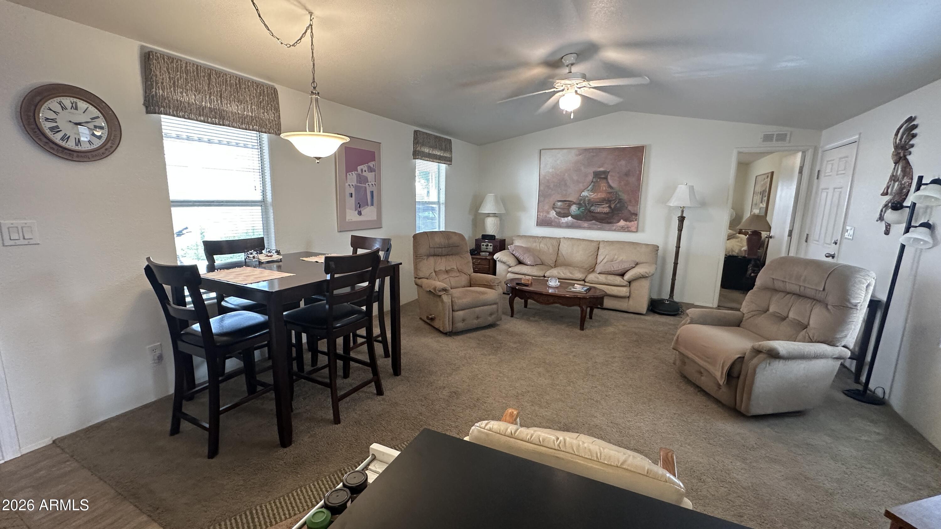 834 South Meridian Road, Unit 174 Apache Junction, AZ 85120 - Photo 30 of 56 a living room with furniture and a large window