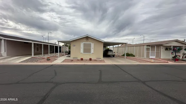 a view of a house with car parked