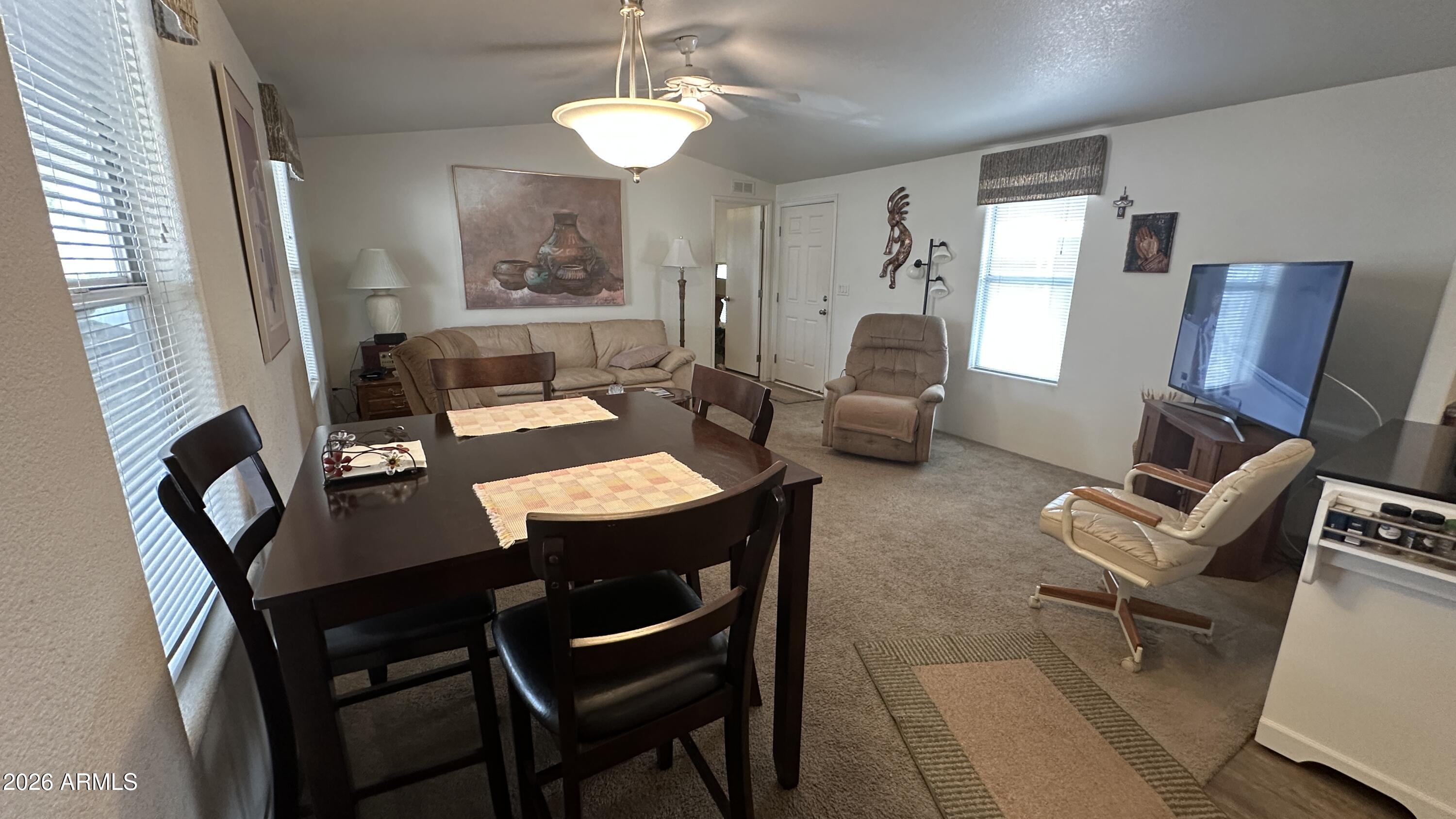 834 South Meridian Road, Unit 174 Apache Junction, AZ 85120 - Photo 32 of 56 a view of a dining room with furniture