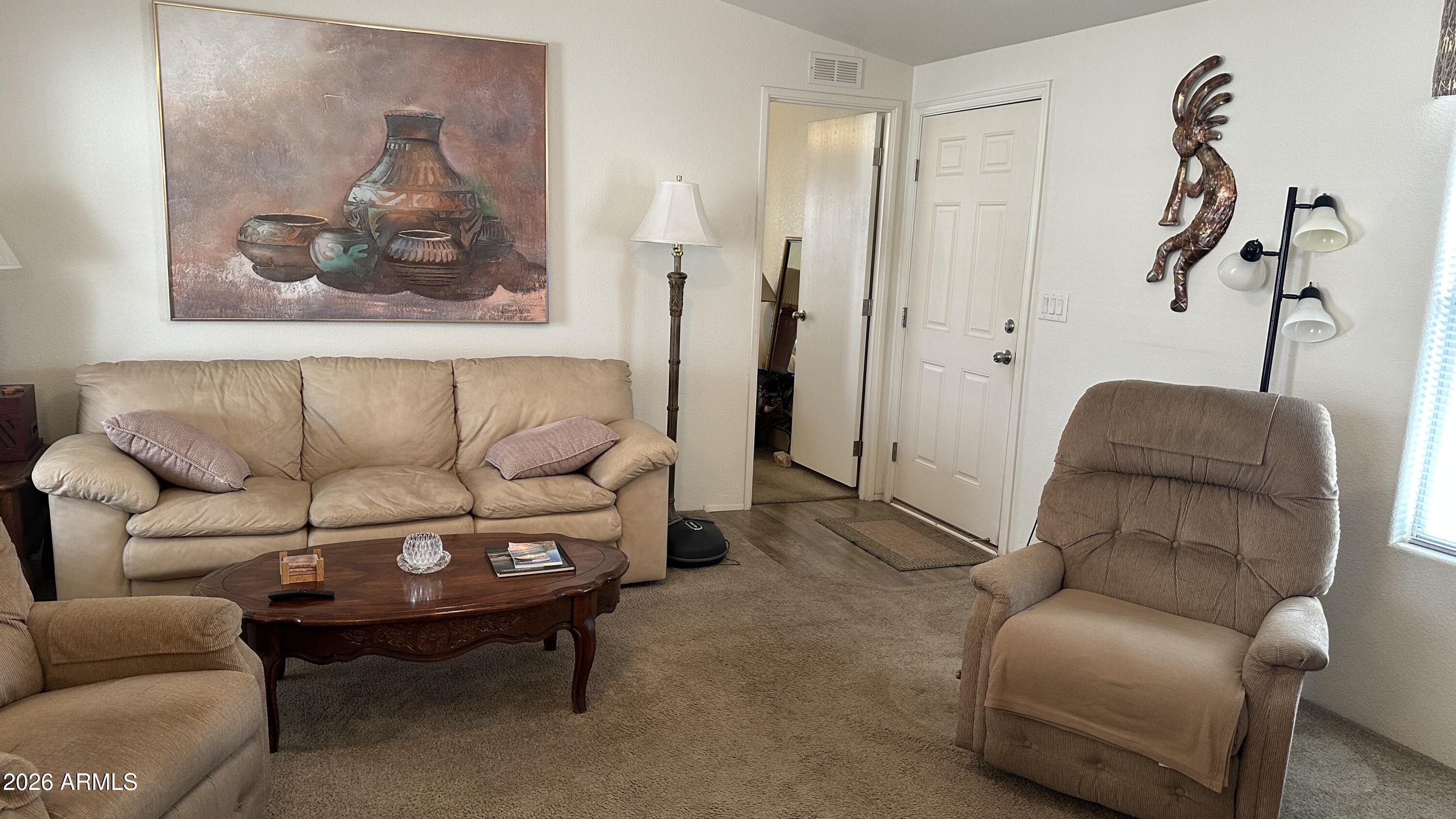 834 South Meridian Road, Unit 174 Apache Junction, AZ 85120 - Photo 37 of 56 a living room with furniture and a couch