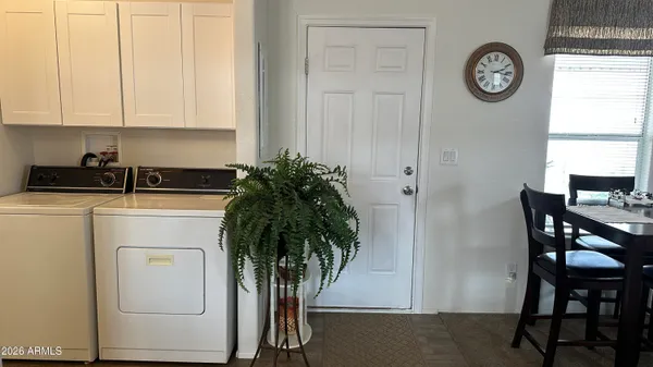 a bed room with a bed and a chair