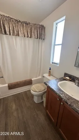 a living room with a couch and a window