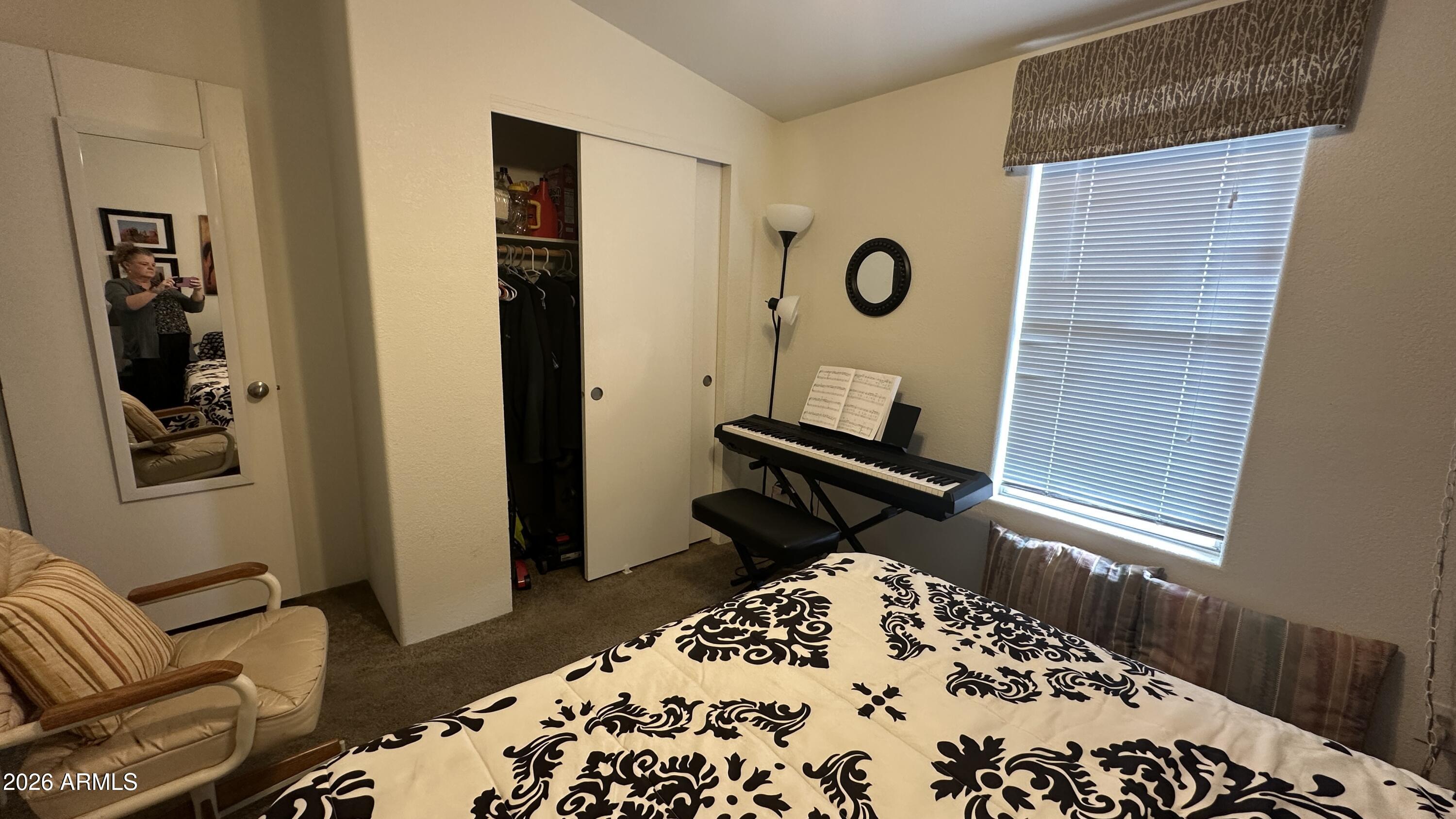 834 South Meridian Road, Unit 174 Apache Junction, AZ 85120 - Photo 55 of 56 a living room with a couch and a dresser