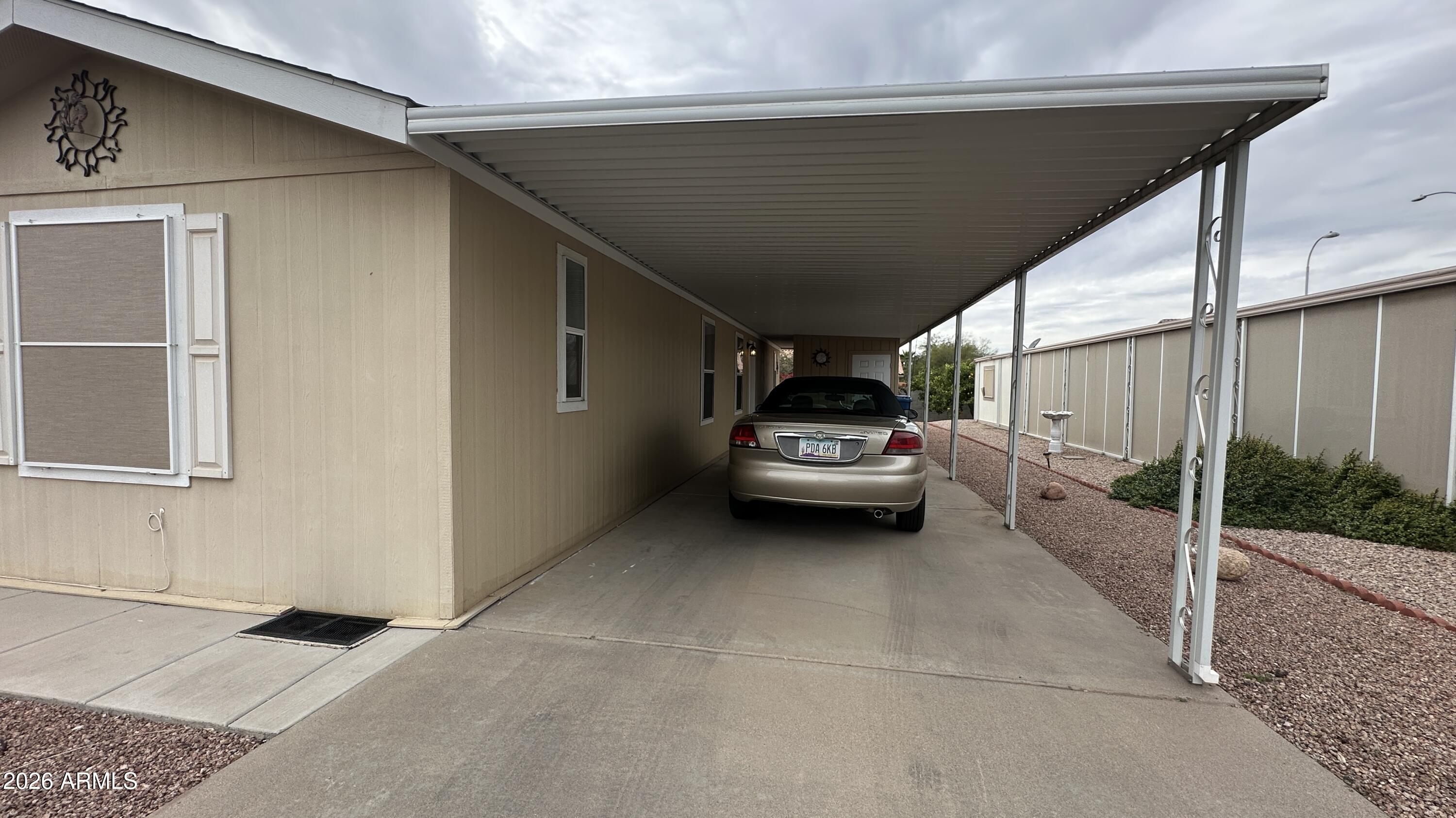 834 South Meridian Road, Unit 174 Apache Junction, AZ 85120 - Photo 7 of 56 a view of a car parked in garage