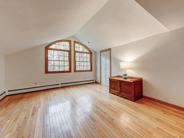 a view of a room with window and wooden floor