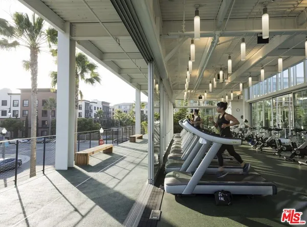 a view of a patio with table and chairs and potted plants