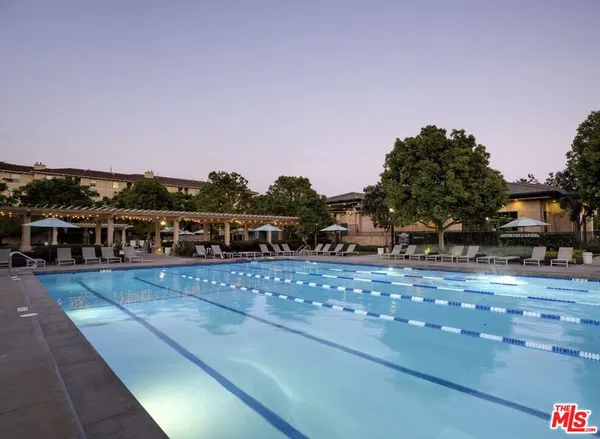 a view of a swimming pool with an outdoor seating