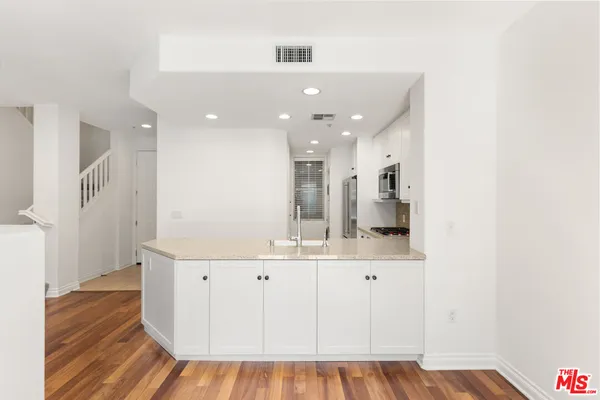 a view of kitchen with wooden floor