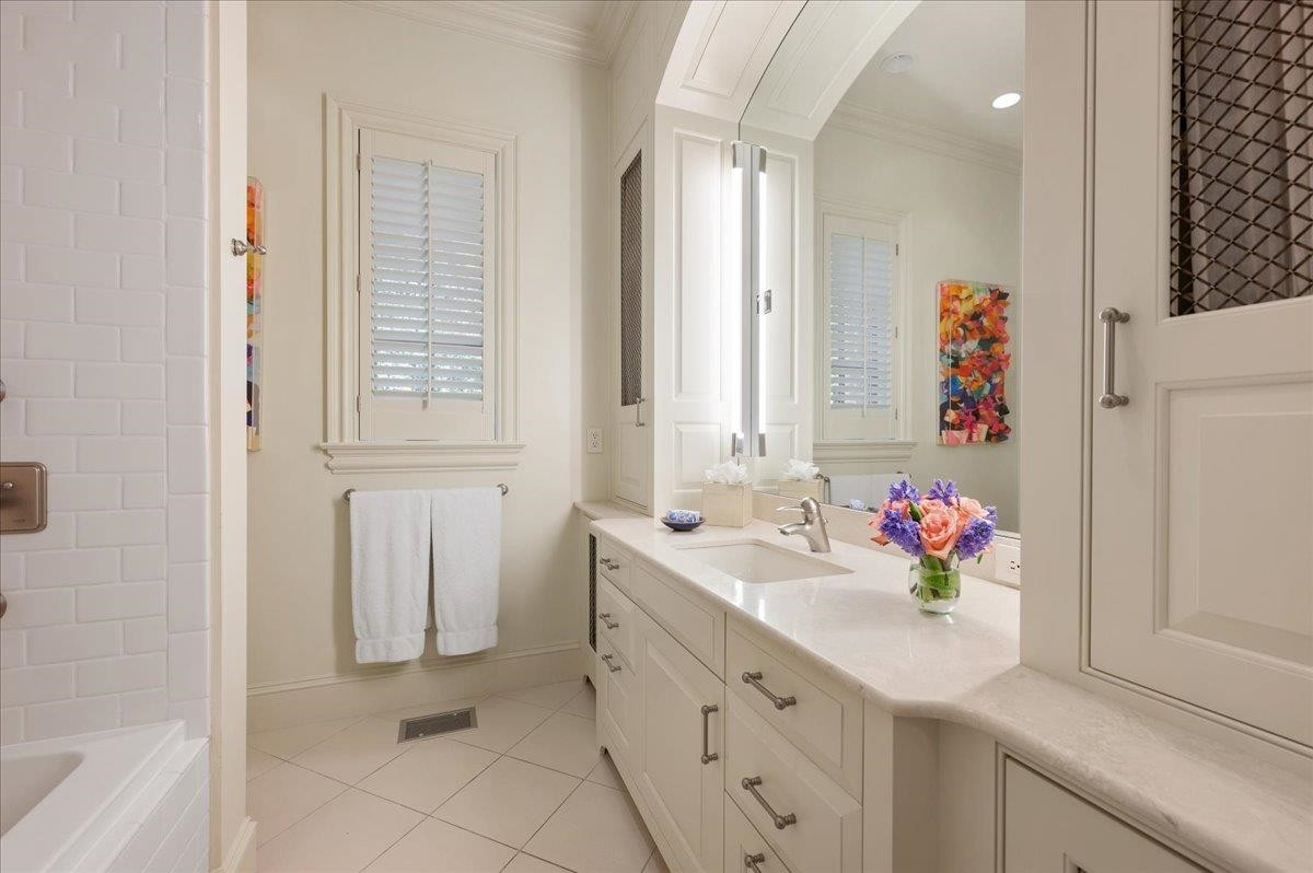 3300 Avon Road Durham, NC 27707 - Photo 34 of 67 a bathroom with a sink vanity tub and a mirror