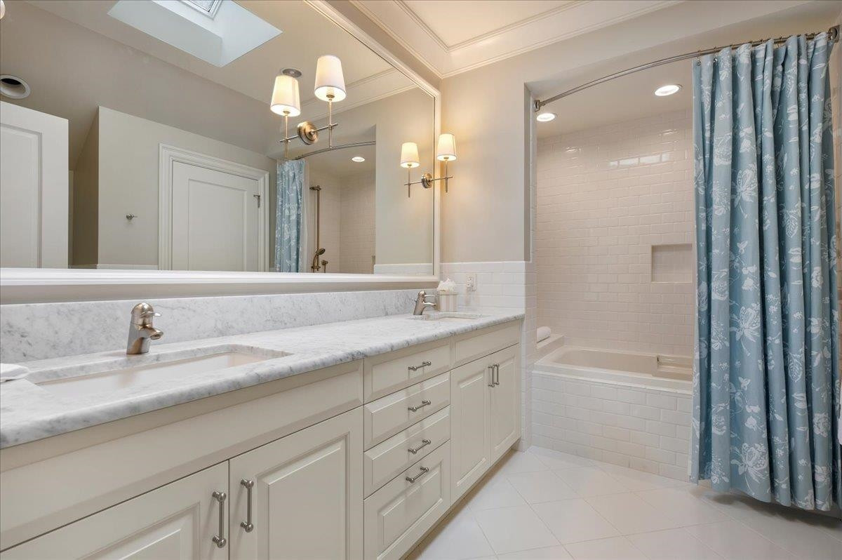 3300 Avon Road Durham, NC 27707 - Photo 38 of 67 a bathroom with a granite countertop sink mirror and bathtub