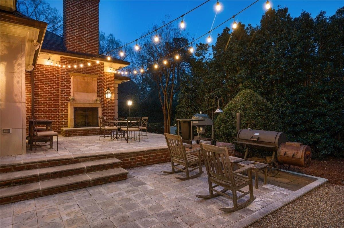 3300 Avon Road Durham, NC 27707 - Photo 64 of 67 a view of a patio with dining table and chairs with a fire pit