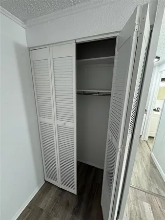 a view of front door with wooden floor