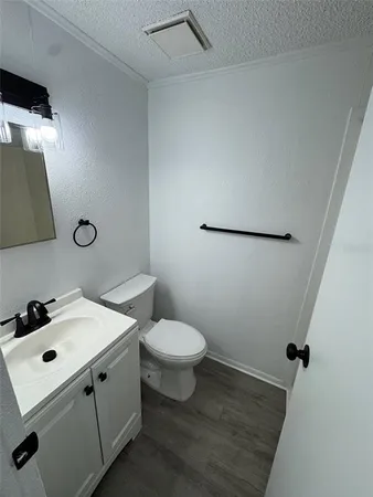 a bathroom with a sink toilet and vanity