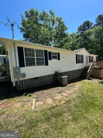 a house with trees in the background