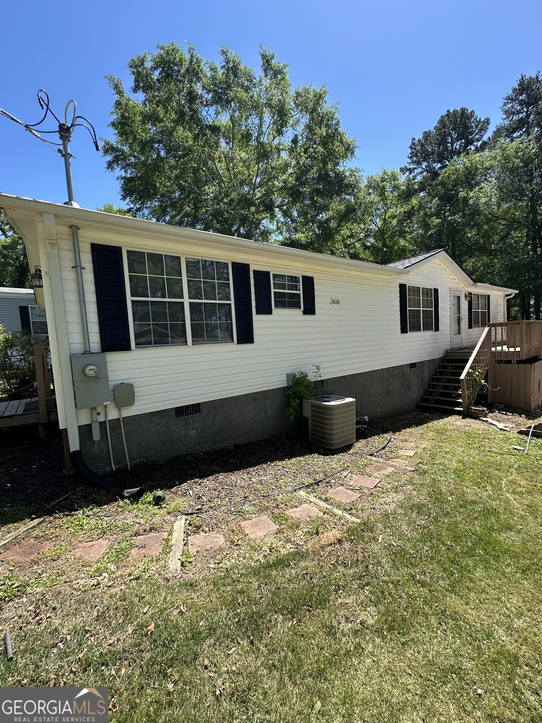 a house with trees in the background