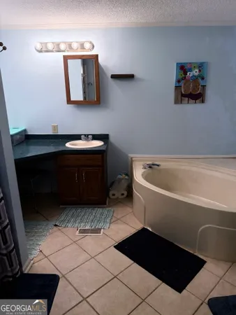 a bathroom with a bathtub and a sink